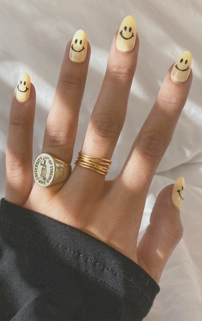 Pastel Yellow Smiley Face Nails