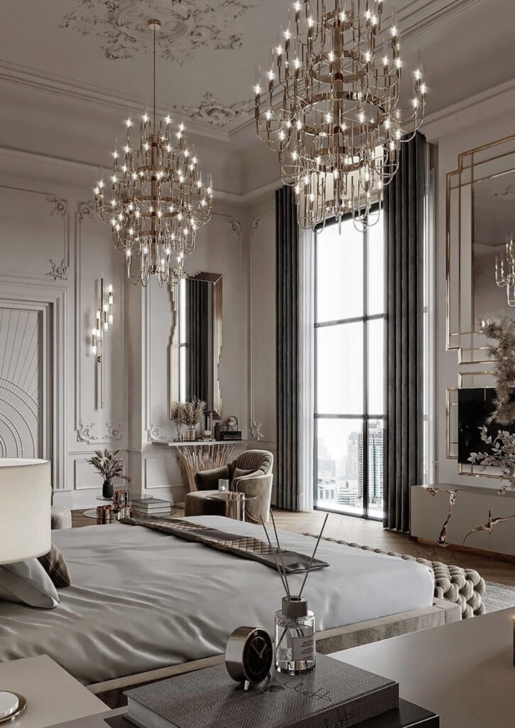 Bedroom with decorative molding and chandeliers