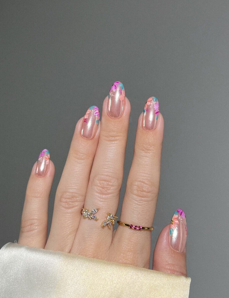 Chrome pink nails with floral designs
