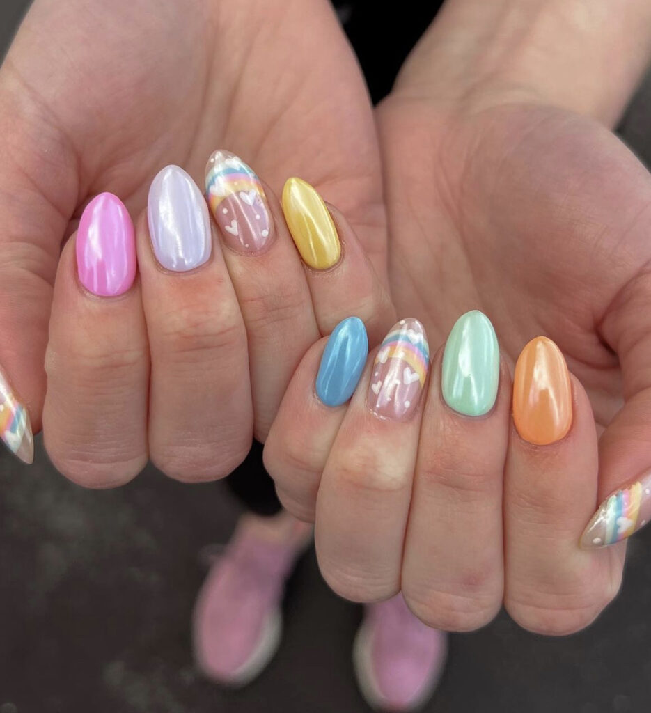 Pastel alternating chrome nails with rainbow nail art