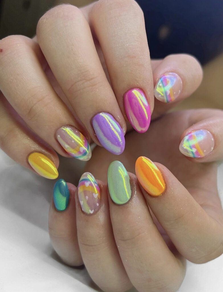 Pastel alternating chrome nails with rainbow nail art