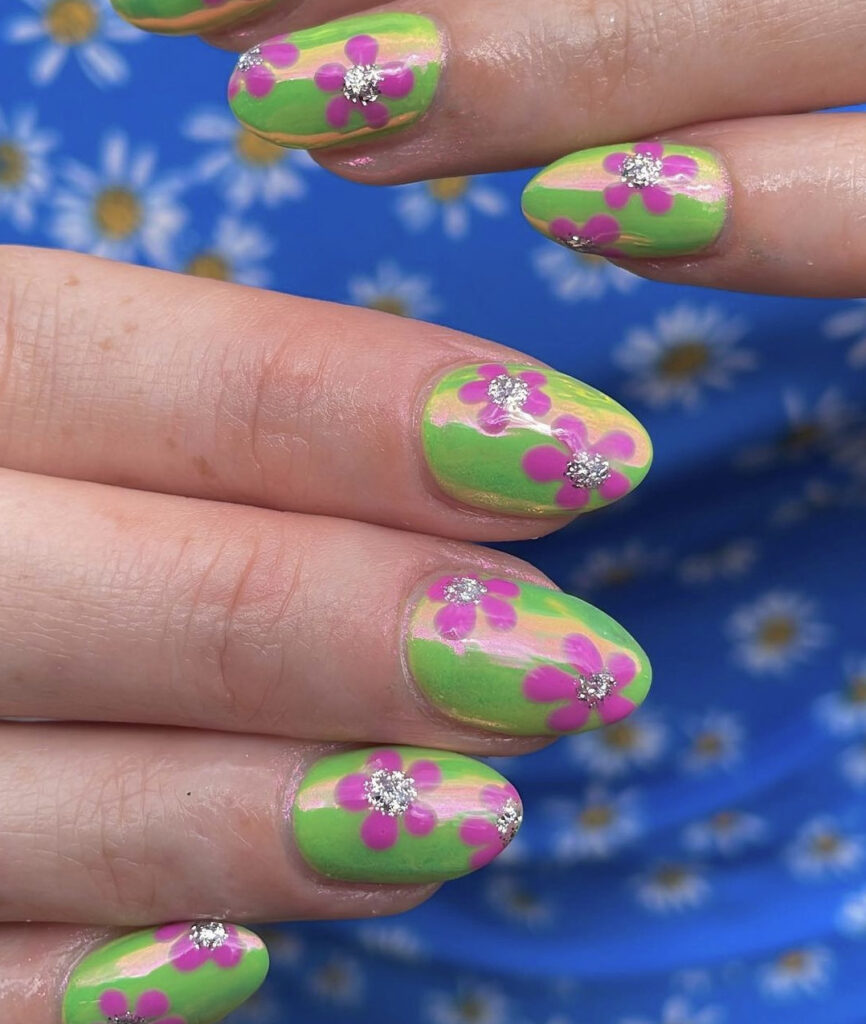 Pink and green flower chrome nails with silver glitter