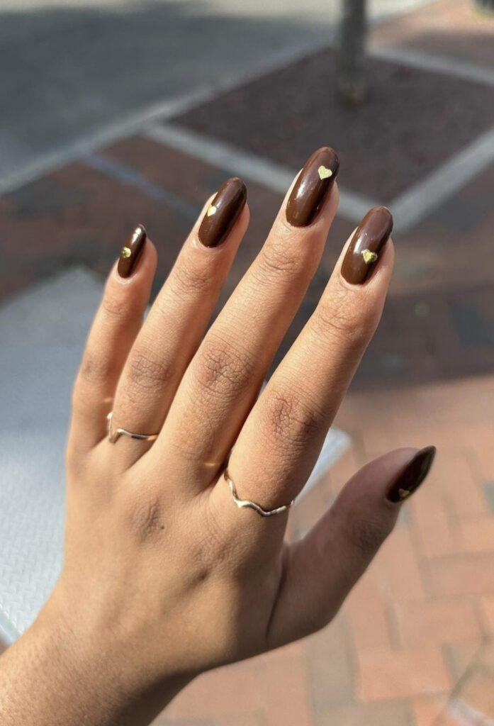 Solid Brown Nails with Small Gold Heart Designs