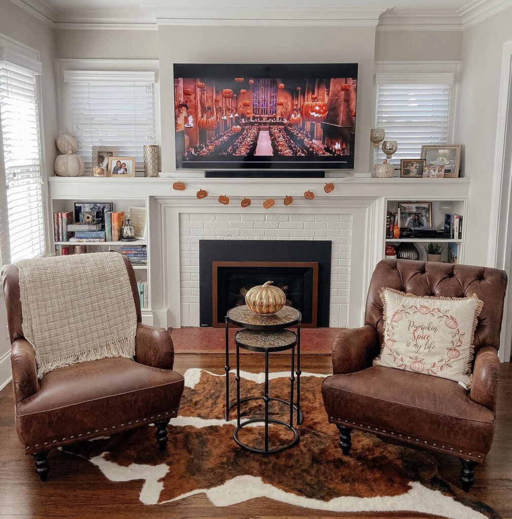 Neutral Fall Seating Area by the Fireplace with Leather Seats