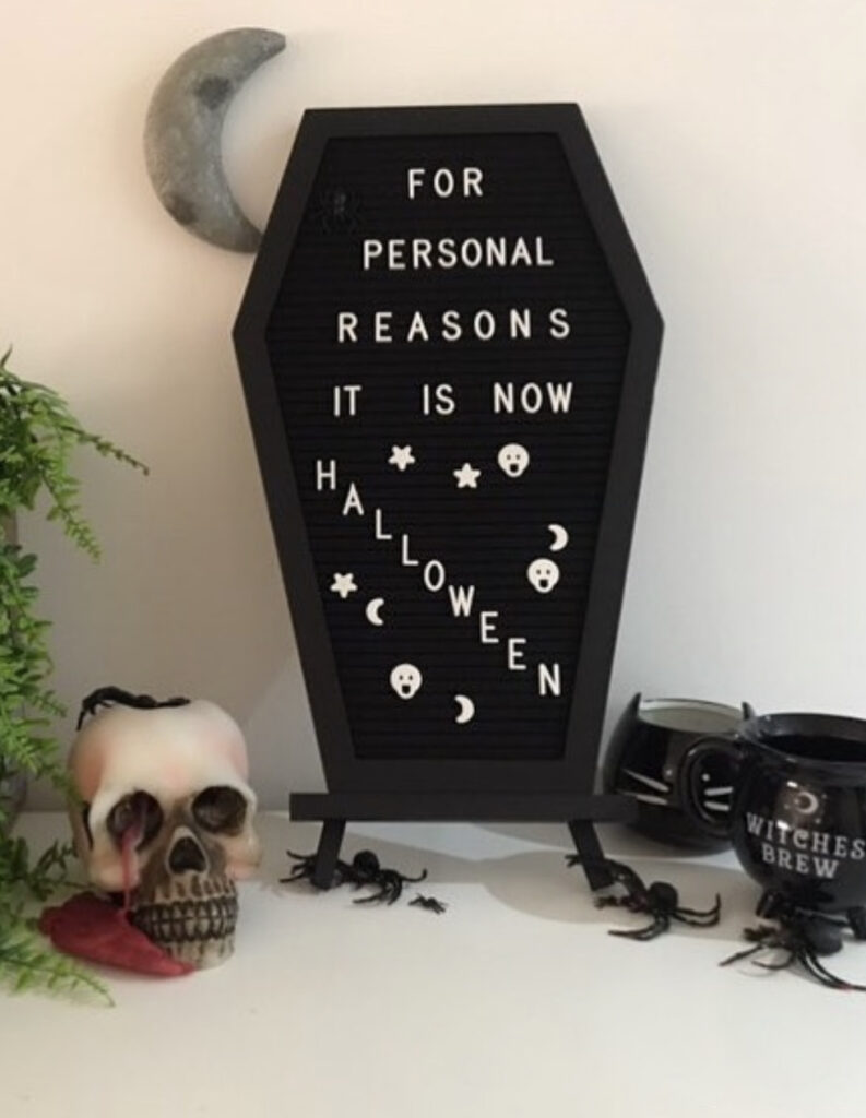 coffin shaped letterboard with halloween quote