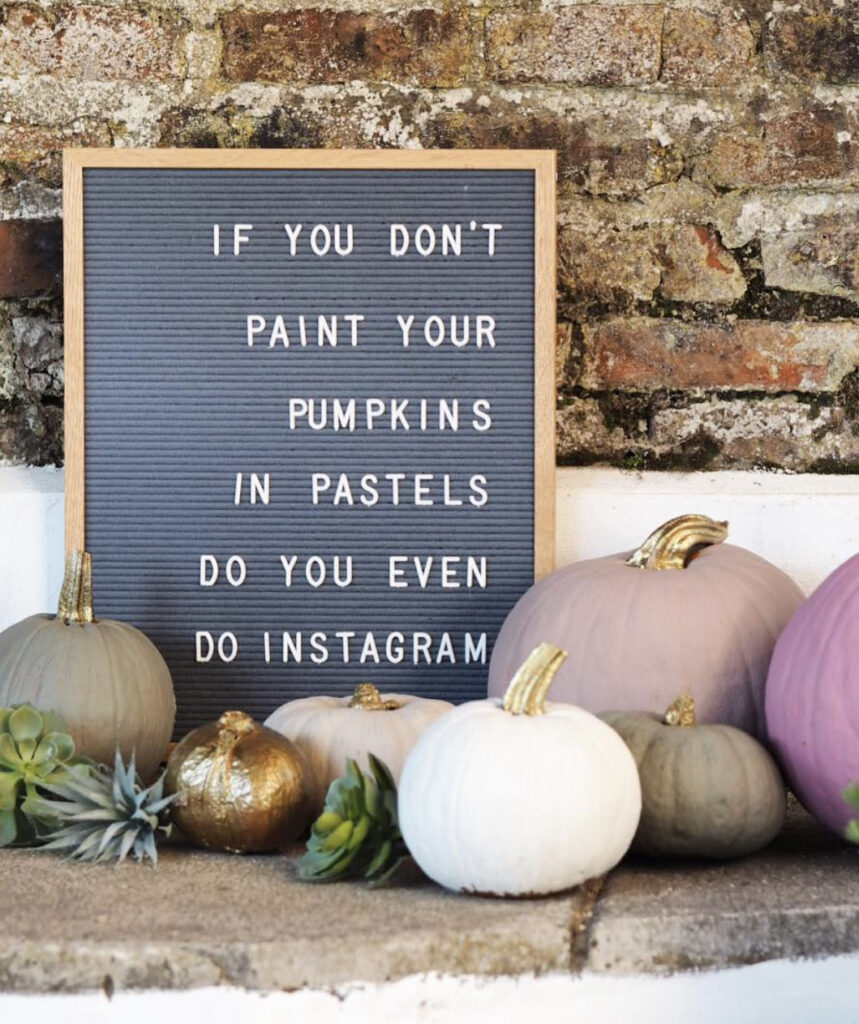 letterboard with halloween quote and pastel pumpkins