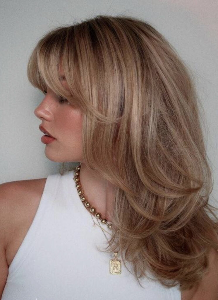 Voluminous Blended Curtain Bangs with Honey Highlights