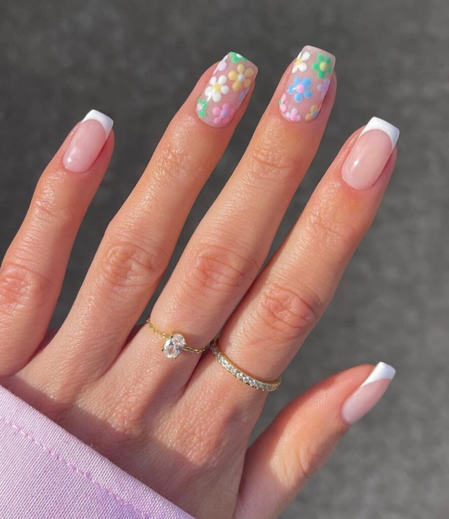 Nude nails with white tips & multicolor pastel daisies