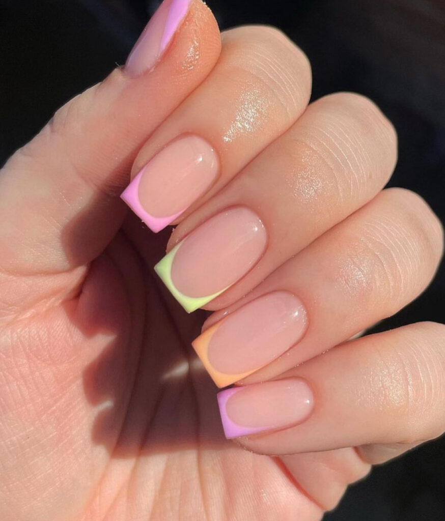 Simple square nude nails with pink, green, and orange pastel tips