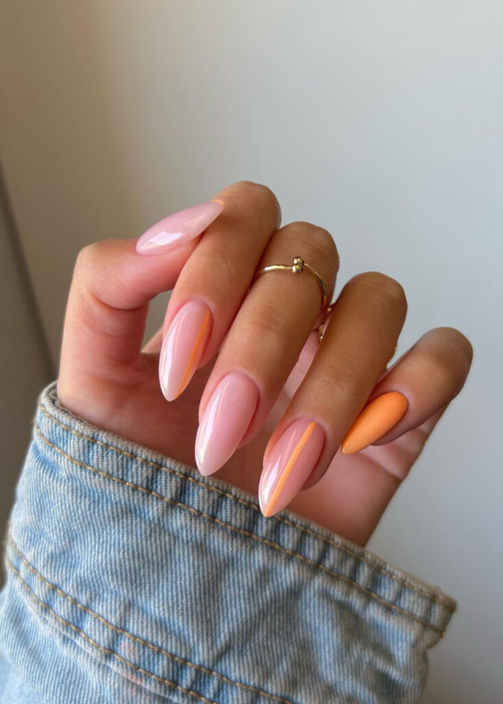Orange sherbert inspired spring nails with simple line art