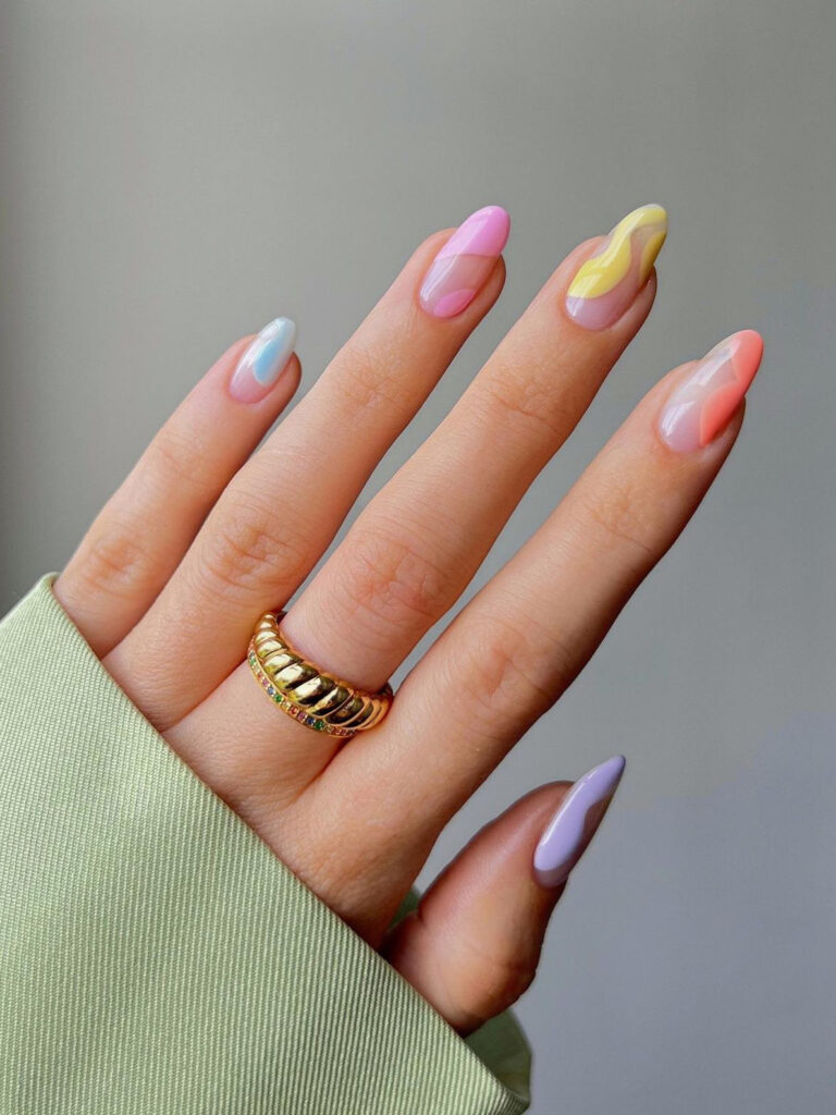 Wavy mix & match pastel designs on nude nails