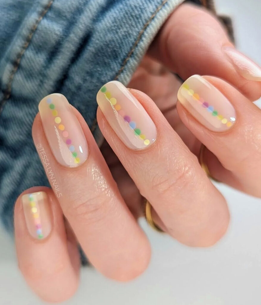 Nude nails with pastel spring colors dot designs