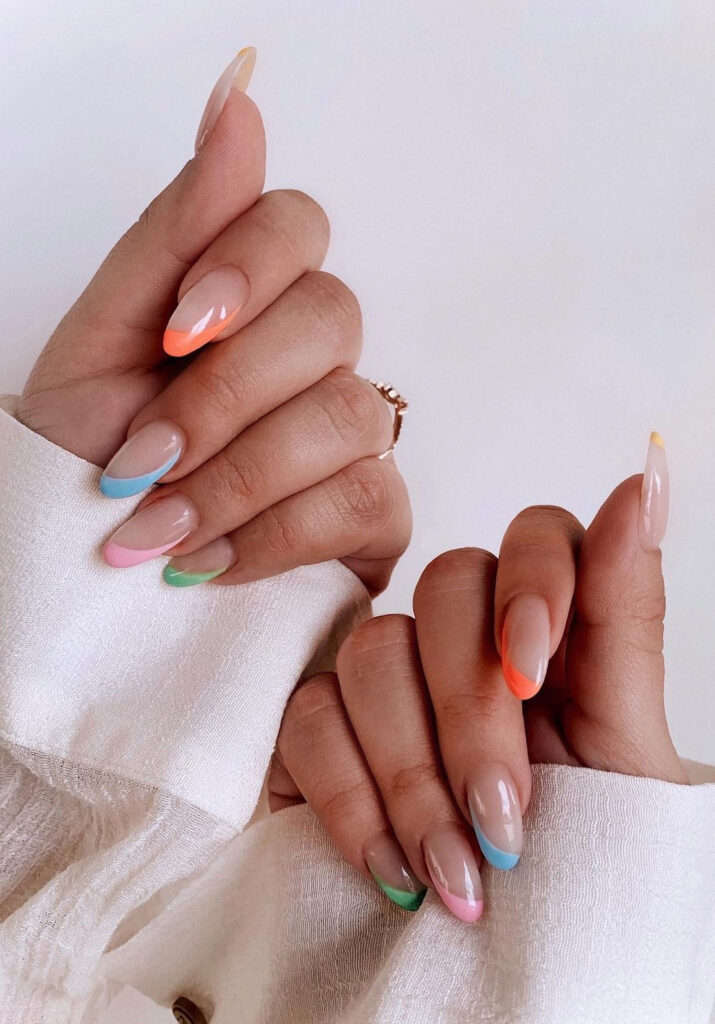 Nude nails with asymmetrical mix & match pastel tips